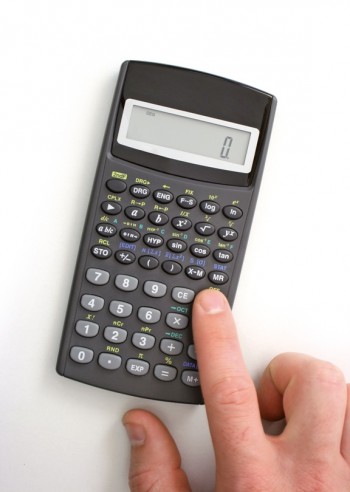 Top view of using a pocket calculator